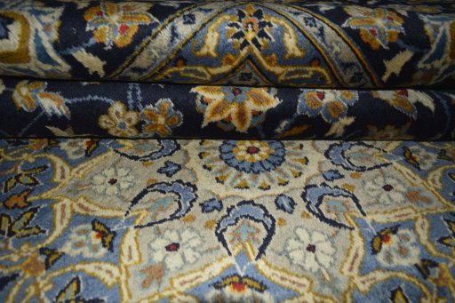 Close-up detail of 2000s Kashan rug from Iran / Persia showing Wool weave