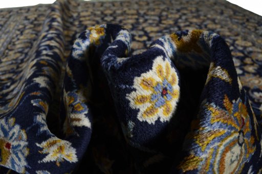 Surface texture of 2000s Kashan rug with natural Wool and intricate pattern