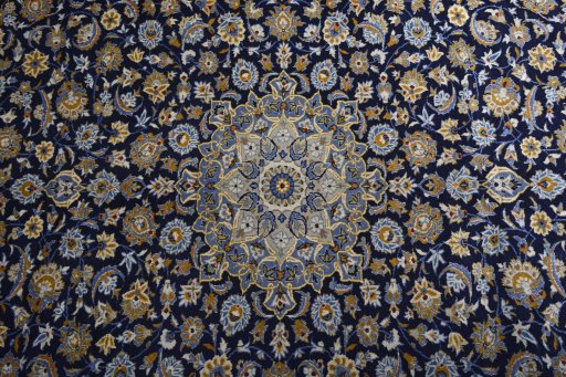 Central medallion detail of 2000s Kashan rug from Iran / Persia