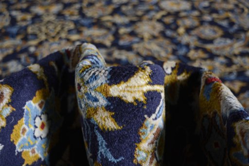Surface texture of 2000s Kashan rug with natural Wool and intricate pattern