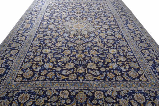 Surface texture of 2000s Kashan rug with natural Wool and intricate pattern