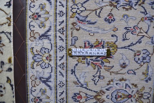 Corner detail of 2000s Kashan rug showing border pattern and Wool pile