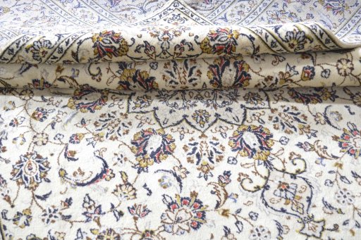 Close-up detail of 2000s Kashan rug from Iran / Persia showing Wool weave