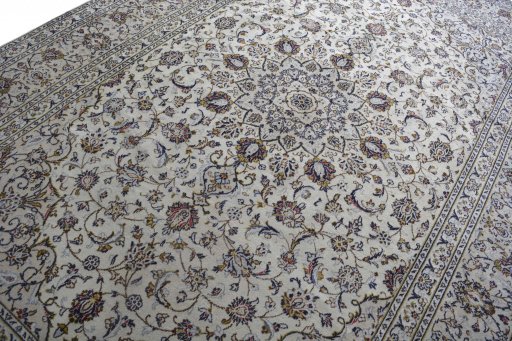 Backside of handmade 2000s Kashan rug showing knot structure and weave density