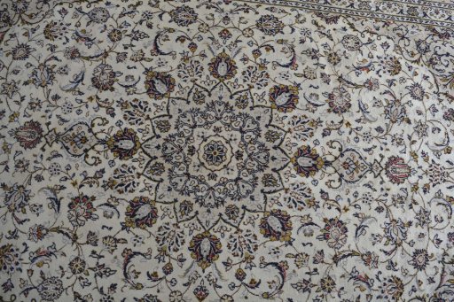 Central medallion detail of 2000s Kashan rug from Iran / Persia