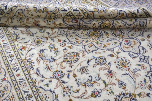 Close-up detail of 2000s Kashan rug from Iran / Persia showing Wool weave