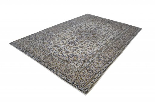 Corner detail of 2000s Kashan rug showing border pattern and Wool pile