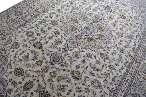 Backside of handmade 2000s Kashan rug showing knot structure and weave density
