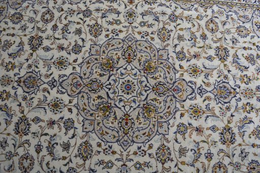 Central medallion detail of 2000s Kashan rug from Iran / Persia