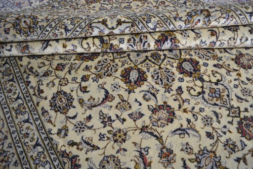 Close-up detail of 2000s Kashan rug from Iran / Persia showing Wool weave