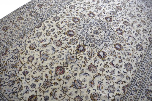 Backside of handmade 2000s Kashan rug showing knot structure and weave density