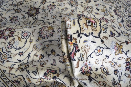 Close-up detail of 2000s Kashan rug from Iran / Persia showing Wool weave