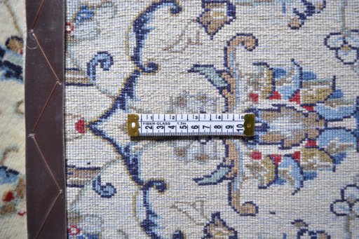 Corner detail of 2000s Kashan rug showing border pattern and Wool pile
