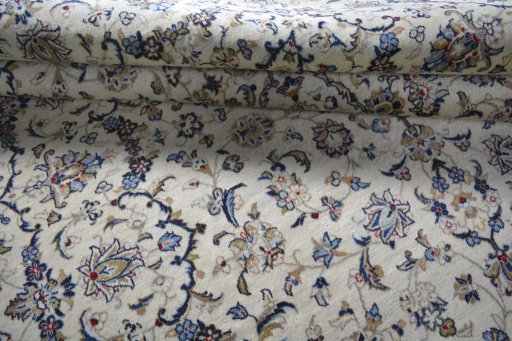 Close-up detail of 2000s Kashan rug from Iran / Persia showing Wool weave