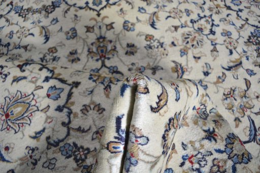 Surface texture of 2000s Kashan rug with natural Wool and intricate pattern