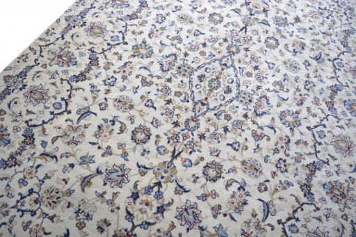 Backside of handmade 2000s Kashan rug showing knot structure and weave density