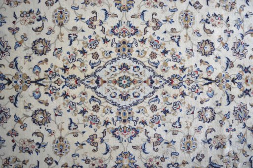 Central medallion detail of 2000s Kashan rug from Iran / Persia