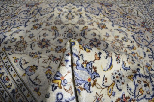 Surface texture of 2000s Kashan rug with natural Wool and intricate pattern