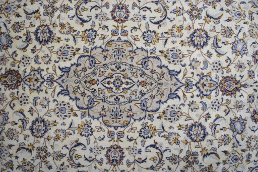 Central medallion detail of 2000s Kashan rug from Iran / Persia