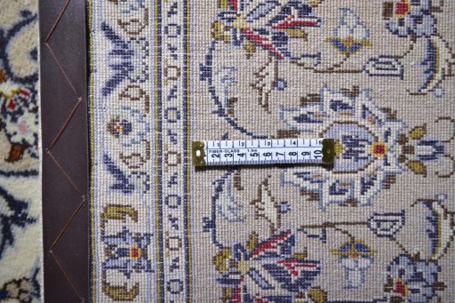 Corner detail of 2000s Kashan rug showing border pattern and Wool pile