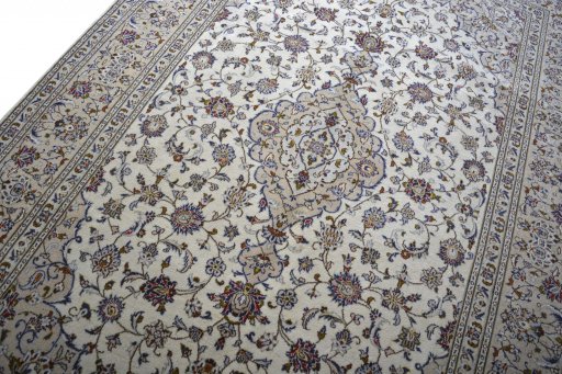 Backside of handmade 2000s Kashan rug showing knot structure and weave density
