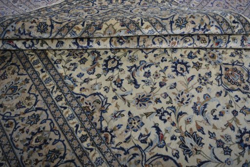 Close-up detail of 2000s Kashan rug from Iran / Persia showing Wool weave