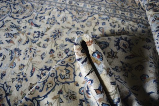 Surface texture of 2000s Kashan rug with natural Wool and intricate pattern