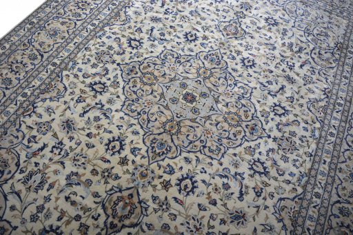 Backside of handmade 2000s Kashan rug showing knot structure and weave density