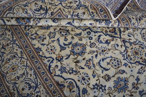 Close-up detail of 2000s Kashan rug from Iran / Persia showing Wool weave