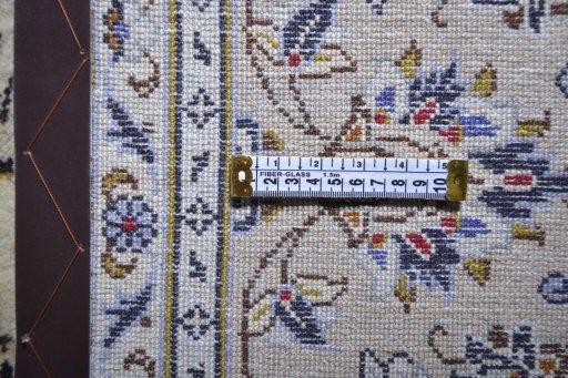 Corner detail of 2000s Kashan rug showing border pattern and Wool pile