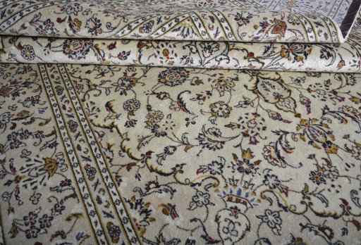 Close-up detail of 2000s Kashan rug from Iran / Persia showing Wool weave