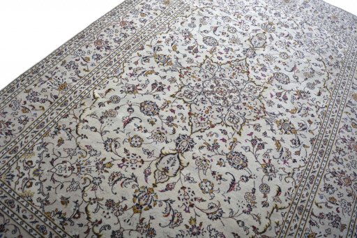Backside of handmade 2000s Kashan rug showing knot structure and weave density