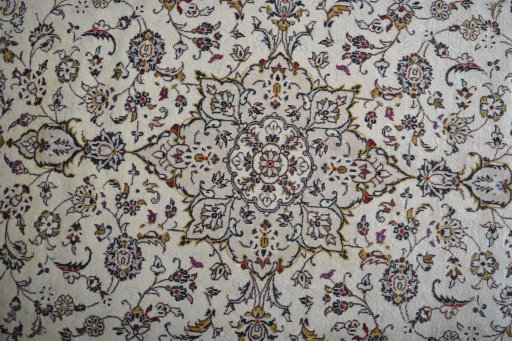 Central medallion detail of 2000s Kashan rug from Iran / Persia