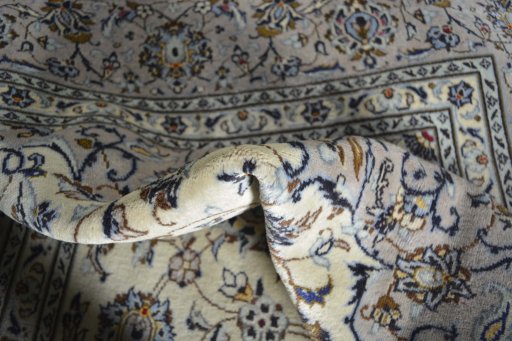 Surface texture of 2000s Kashan rug with natural Wool and intricate pattern