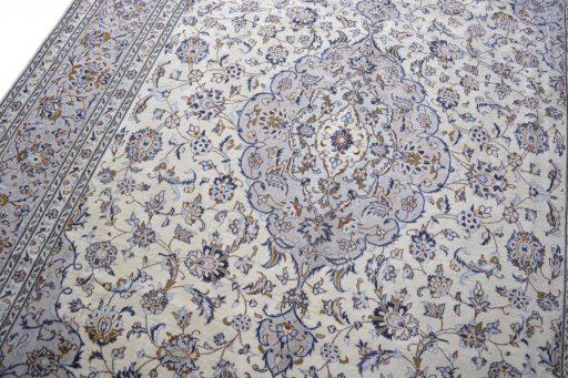 Backside of handmade 2000s Kashan rug showing knot structure and weave density