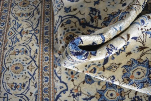 Close-up detail of 2000s Kashan rug from Iran / Persia showing Wool weave