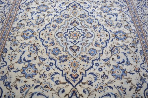 Backside of handmade 2000s Kashan rug showing knot structure and weave density
