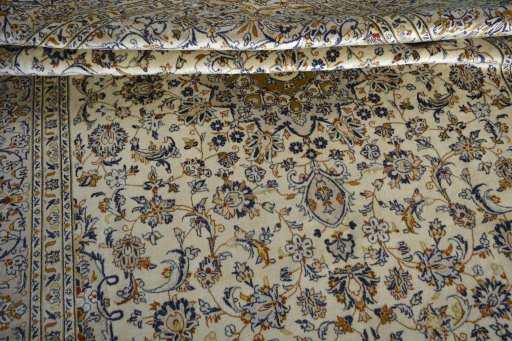 Close-up detail of 2000s Kashan rug from Iran / Persia showing Wool weave