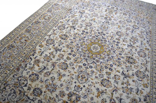 Backside of handmade 2000s Kashan rug showing knot structure and weave density