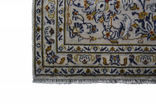 Close-up detail of 2000s Kashan rug from Iran / Persia showing Wool weave