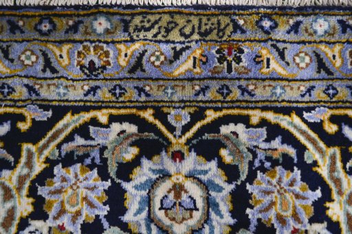 Close-up detail of 2000s Kashan rug from Iran / Persia showing Wool weave