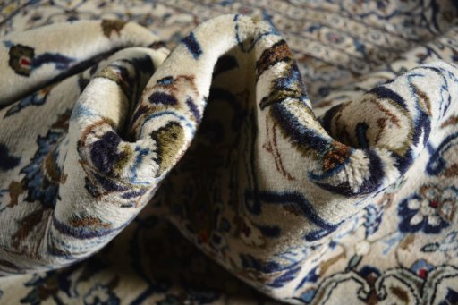 Surface texture of 2000s Kashan rug with natural Wool and intricate pattern