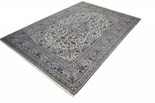 Corner detail of 2000s Kashan rug showing border pattern and Wool pile
