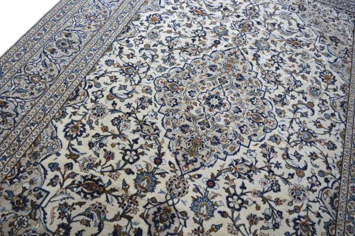 Backside of handmade 2000s Kashan rug showing knot structure and weave density