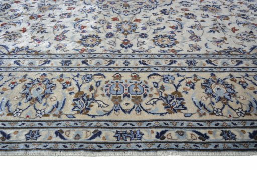 Corner detail of 2000s Kashan rug showing border pattern and Wool pile