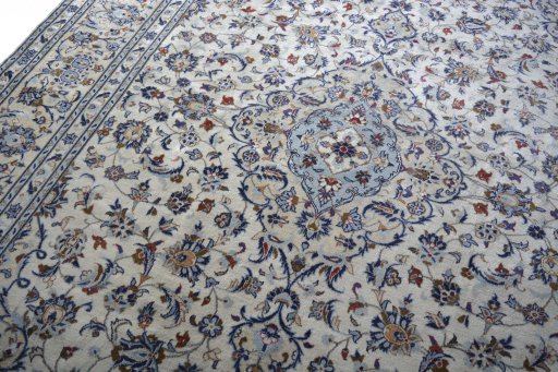 Backside of handmade 2000s Kashan rug showing knot structure and weave density