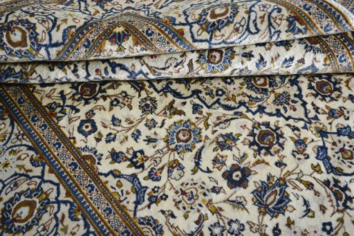 Close-up detail of 2000s Kashan rug from Iran / Persia showing Wool weave
