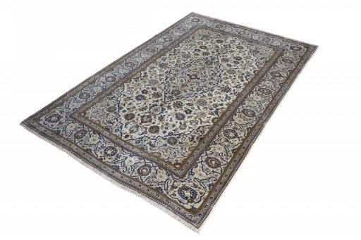 Corner detail of 2000s Kashan rug showing border pattern and Wool pile