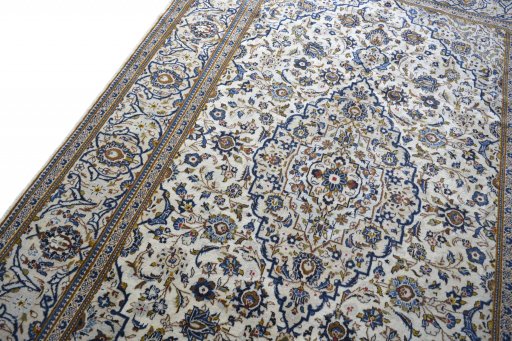 Backside of handmade 2000s Kashan rug showing knot structure and weave density