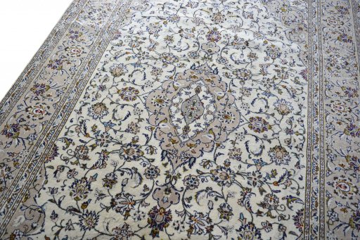 Backside of handmade 2000s Kashan rug showing knot structure and weave density